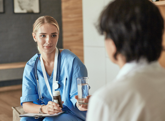 nurse giving patient alcohol detox medication